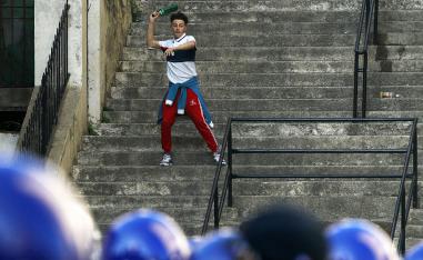 A demonstrator throw a bottle during clashes with police in Algiers, Algeria, March 29, 2019.
