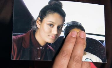 Renu Begum, sister of teenage British girl Shamima Begum, holds a photo of her sister as she makes an appeal for her to return home at Scotland Yard, in London, Britain February 22, 2015.
