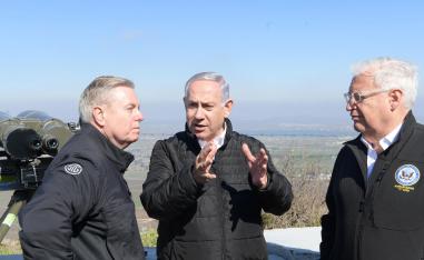 Israeli Prime Minister Benjamin Netanyahu (C), US Ambassador in Israel David Friedman (R) and US Senator Lindsey Graham visit the Golan Heights.