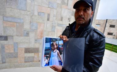 French-Moroccan Mustafa Tarbouni, the maternal uncle of a missing French girl, displays a picture of his niece as he tries to find her in Syria, on March 25, 2019 in the northern town of Qamishli.