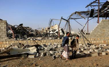  Civilians inspect the damage after a reported airstrike by Saudi-led coalition