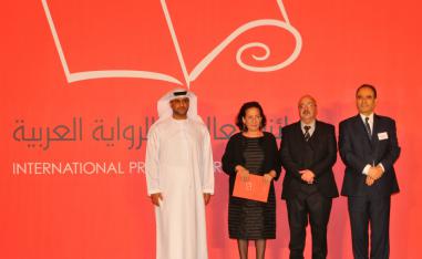 Hoda Barakat (2nd L) accepts the International Prize for Arab Fiction
