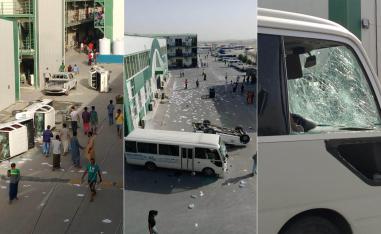 عمال يقلبون السيارات ويحطمون زجاجها في مجمع للعمال في الدوحة