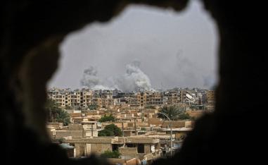 Smoke billows out following a coalition air strike in the western al-Daraiya neighbourhood of the embattled northern Syrian city of Raqa on Sept. 5, 2017