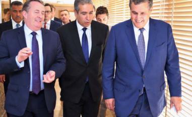 Britain’s International Trade Secretary Liam Fox (L) talking to Aziz Akhannouch (R) 