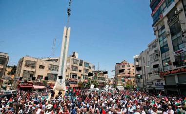 Palestinian demonstrators attend a rally marking the Nakba in Ramallah