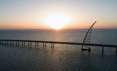 Sunset view of the arch pylon on the Sheikh Jaber al-Ahmad Al-Sabah Causeway which will lead to the Future Silk City