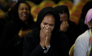 A mourner reacts during a memorial ceremony for the Ethiopian Army Chief of Staff Seare Mekonnen