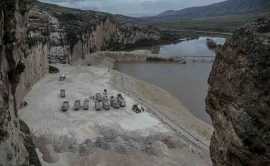 Trucks are seen on the banks of the Tigris River near Hasankeyf, last December