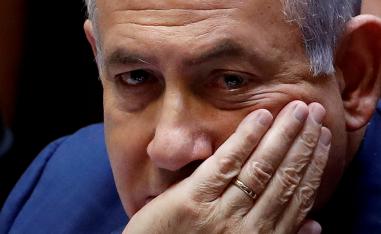Israeli Prime Minister Benjamin Netanyahu sits at the plenum at the Knesset