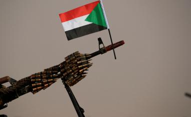 A Sudanese national flag is attached to a machine gun of Paramilitary Rapid Support Forces (RSF) soldiers