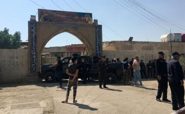 Iraqi security forces inspect the site of a bomb attack at a mosque in the Baladiyat neighbourhood of Baghdad