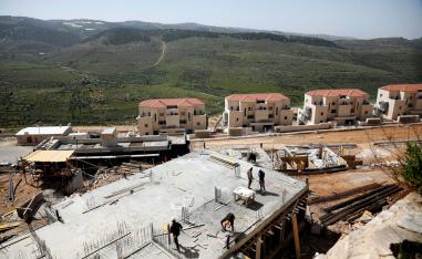 Labourers work at a construction site in the Israeli settlement of Beitar Illit in the Israeli-occupied West Bank