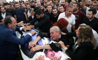 The mother and relatives of Rami Salman react during his funeral in Ramlieh, Lebanon