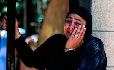 A Palestinian woman of the Siyam family reacts as the family is evicted from their home in the Palestinian neighbourhood of Silwan