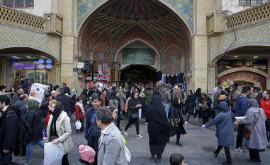 People walk around the Grand Bazaar in Tehran