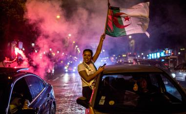 Algeria supporters celebrate on the Champs-Elysees in Paris