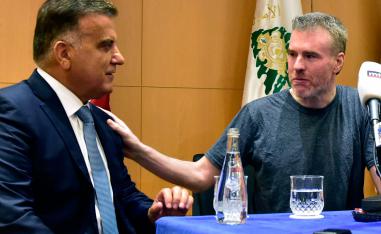 Kristian Lee Baxter (R) pats the shoulder of Lebanese security chief Abbas Ibrahim (L)
