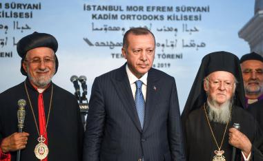 Turkish President Recep Tayyip Erdogan (C), Syriac (Assyrian) Orthodox Patriarch Yusuf Cetin (L) and Ecumenical Patriarch of Constantinople Bartholomew I (R)