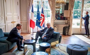 French President Emmanuel Macron and British Prime Minister Boris Johnson speak during a meeting at the Elysee Palace