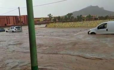 Photographs and videos shared on social media showed muddy waters carrying away people