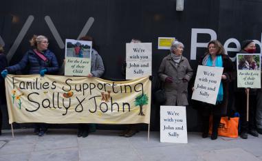 Supporters of John Letts and Sally Lane, parents of Jack Letts who is believed to have left the UK to join Islamic State (IS) hold banners outside the Old Bailey in central London
