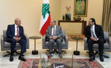Lebanese President Michel Aoun, center, meets with Prime Minister Saad Hariri, right, and Parliament Speaker Nabih Berri, left
