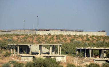 A Turkish observation post (background) is pictured in the town of Morek in northwest Syria