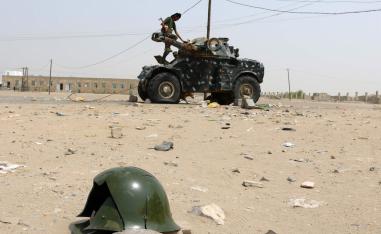 A Fighter with the UAE-trained Security Belt Forces loyal to the pro-independence Southern Transitional Council (STC), stands atop a military vehicle 