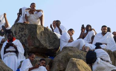 At the peak of Mount Arafat, numerous Muslim pilgrims were absorbed in Koranic verses displayed on their smartphones