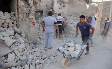 Workers taking part in restorations of the old Aleppo market 