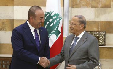 Lebanese President Michel Aoun (R) shakes hands with Turkish FM Mevlut Cavusoglu in Beiteddine Palace  