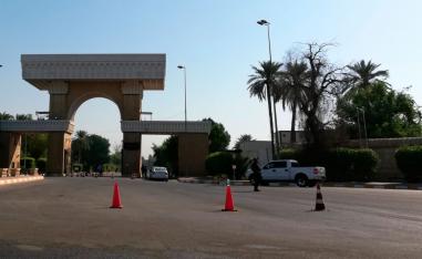 Iraqi security forces verify the identities of those entering the Green Zone in Baghdad