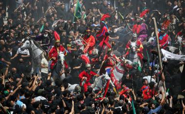 Local actors dressed as ancient warriors re-enact a scene from the 7th century battle of Kerbala