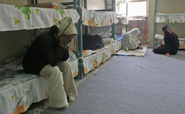 Iranian female prisoners sit in their cells at Evin jail near Tehran