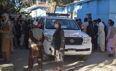 Relatives of Afghan victims arrive outside a hospital, after a suicide attack that targeted a campaign rally for Afghan President Ashraf Ghani