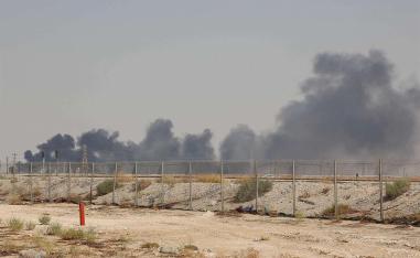 Smoke billows from an Aramco oil facility in Abqaiq 