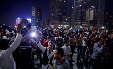 Egyptian protesters shout slogans as they take part in a protest calling for the removal of President Abdel Fattah al-Sisi