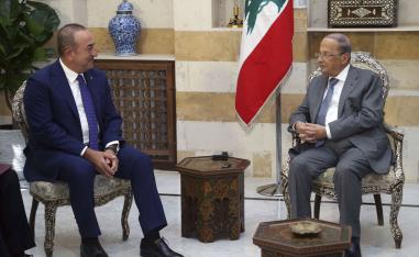Lebanese President Michel Aoun, right, meets with Turkish Foreign Minister Mevlut Cavusoglu in Beirut