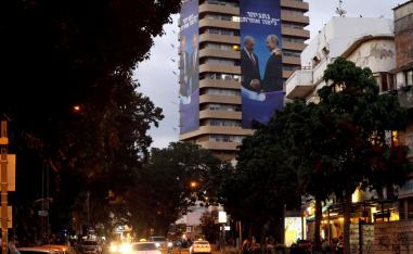 Giant banners of Netanyahu shaking hands with Putin and Trump hung on the Likud's party headquarters
