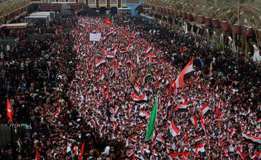 Followers of Shia cleric Moqtada Al Sadr chant slogans against corruption in Karbala, Iraq