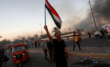 People hold an anti-government protest in Baghdad, Iraq