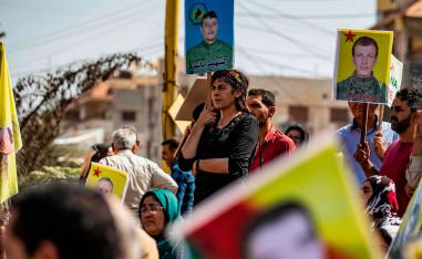 Syrian Kurds demonstrate in front of the United Nations headquarters in the Kurdish-majority city of Qamishli