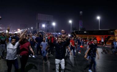 Egyptian protesters shout slogans as they take part in a protest calling for the removal of President Abdel Fattah al-Sisi in Cairo's downtown on September 20