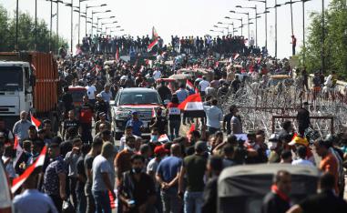 Iraqi protesters gather on the capital Baghdad's Al-Jumhuriyah Bridge