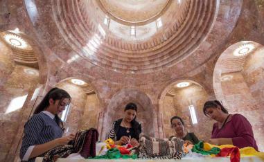 The temple's seven domes topped with sun symbols represent the seven angels revered by the Yazidis