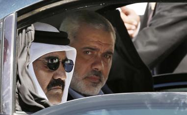 Former Emir of Qatar Sheikh Hamad bin Khalifa al-Thani and Gaza's Hamas prime minister Ismail Haniyeh