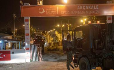 Turkish army soldiers drive towards the border with Syria near Akcakale in Sanliurfa province
