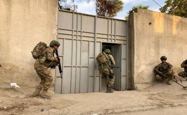 Turkish soldiers are seen in the border town of Tal Abyad, Syria