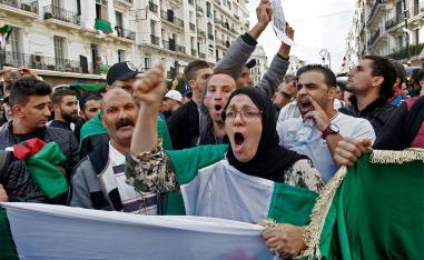 Algerian protesters chant slogans during the 37th consecutive Friday anti-government protests in Algiers